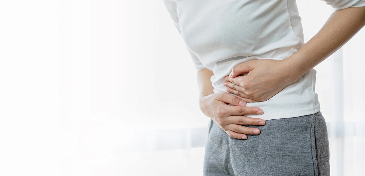 Woman with possible digestive issues related to the colon, such as abdominal cramps, bowel inflammation or other gastrointestinal conditions often associated with colon disorders.